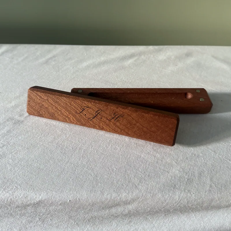 The hardwood box in sapele, engraved on the lid