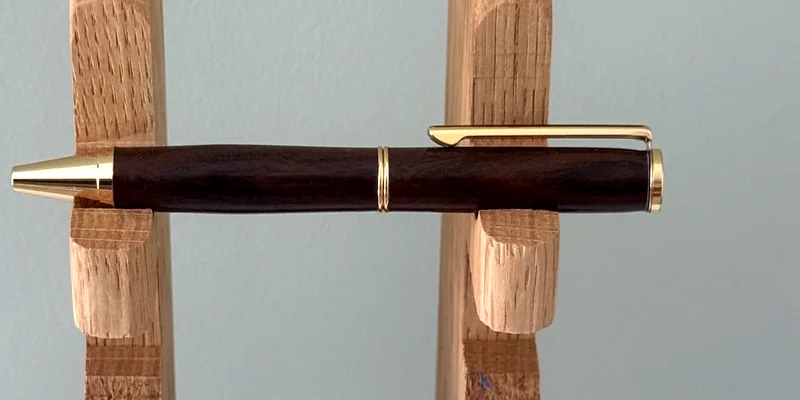 A hand-turned ballpoint pen in Chacate Preto