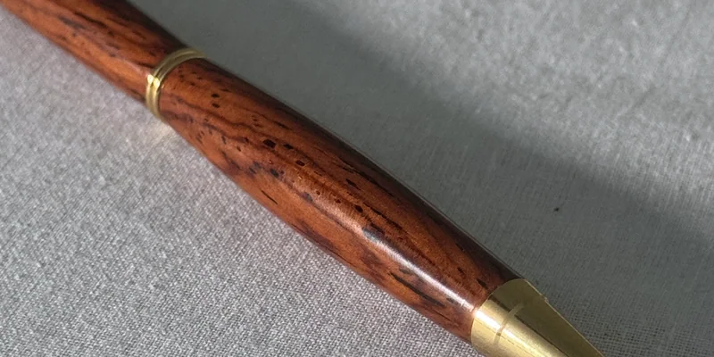 Close-up of a hand-turned pen in Cocobolo