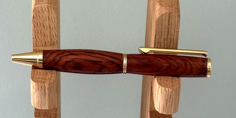 A hand-turned ballpoint pen in Cocobolo
