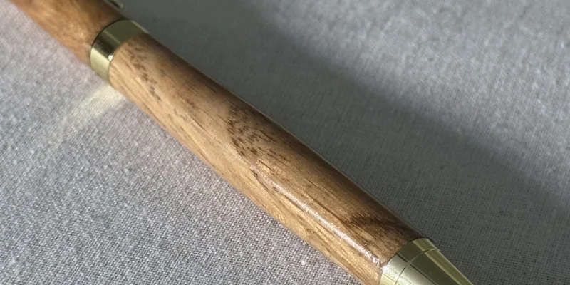 Close-up of a hand-turned pen in Oak