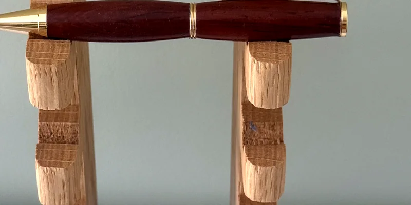 A hand-turned ballpoint pen in Padauk