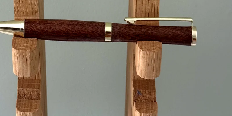 A hand-turned ballpoint pen in Sapele