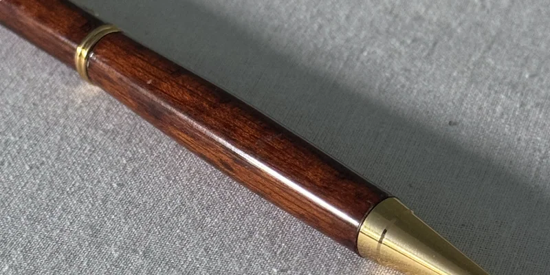 Close-up of a hand-turned pen in Snakewood