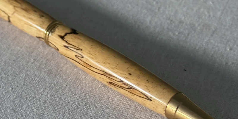 Close-up of a hand-turned pen in Spalted Tamarind