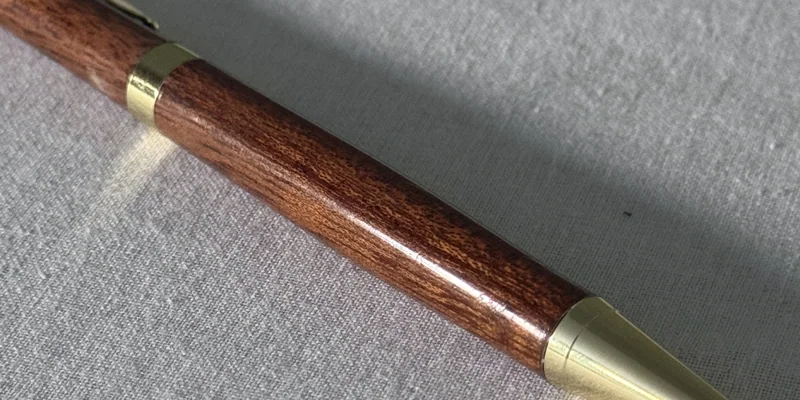 Close-up of a hand-turned pen in Tasmanian Blackwood