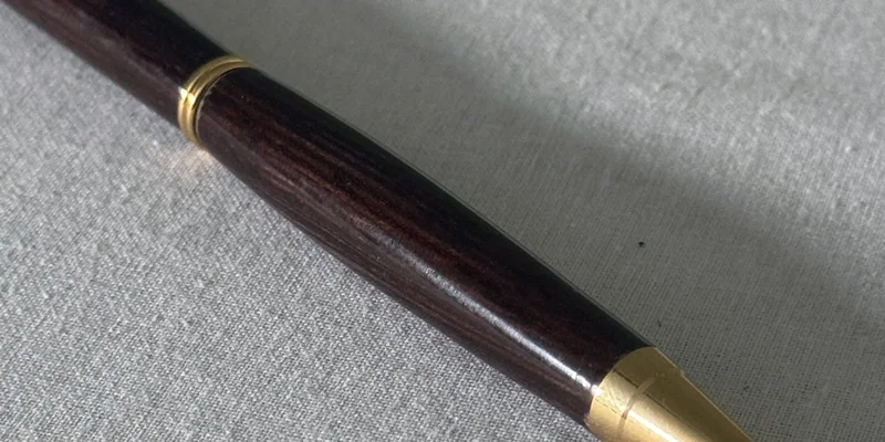 Close-up of a hand-turned pen in Wenge