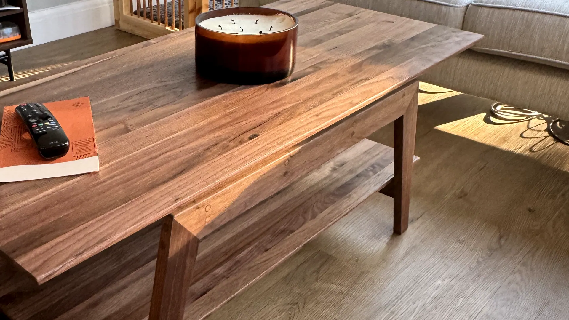 A solid walnut coffee table in a living room